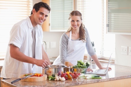 Couple cooking in kitchen