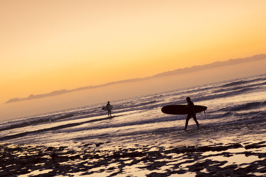 Copyright: <a href='https://www.123rf.com/profile_chasdesign'>chasdesign / 123RF Stock Photo</a> Surfing in Canary Islands