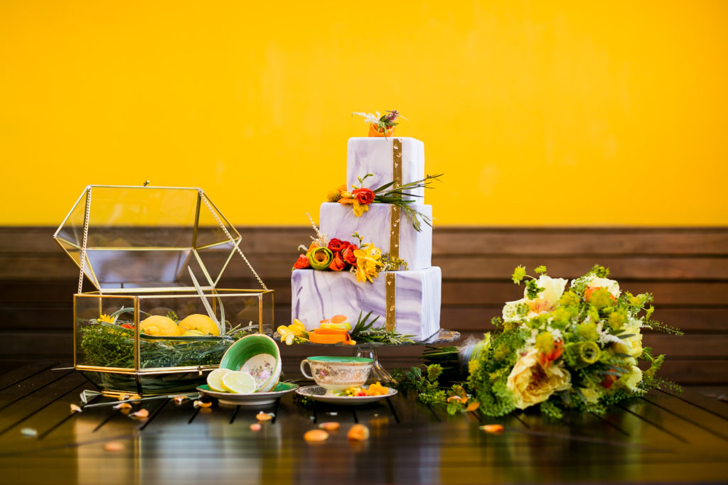 https://www.sarahmackphoto.com/ Citrus shoot with gold card box and cake