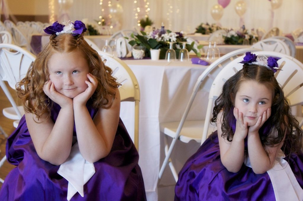 Bored flowergirls at wedding