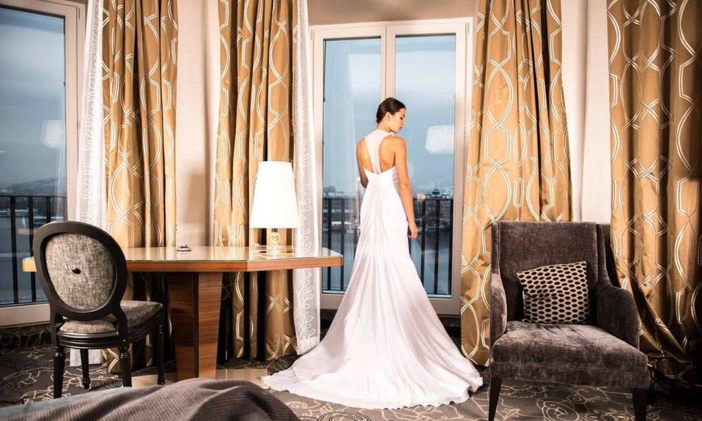 Bride dressing at hotel